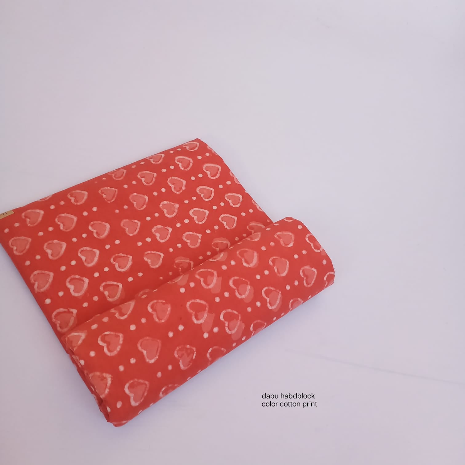 Coral orange heart jaal Dabu handblock printed cotton fabric wholesale